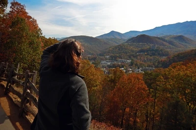 woman looking at Gatlinburg fall foliage