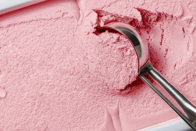 strawberry ice cream being scooped