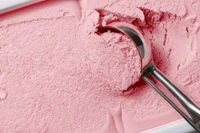 strawberry ice cream being scooped