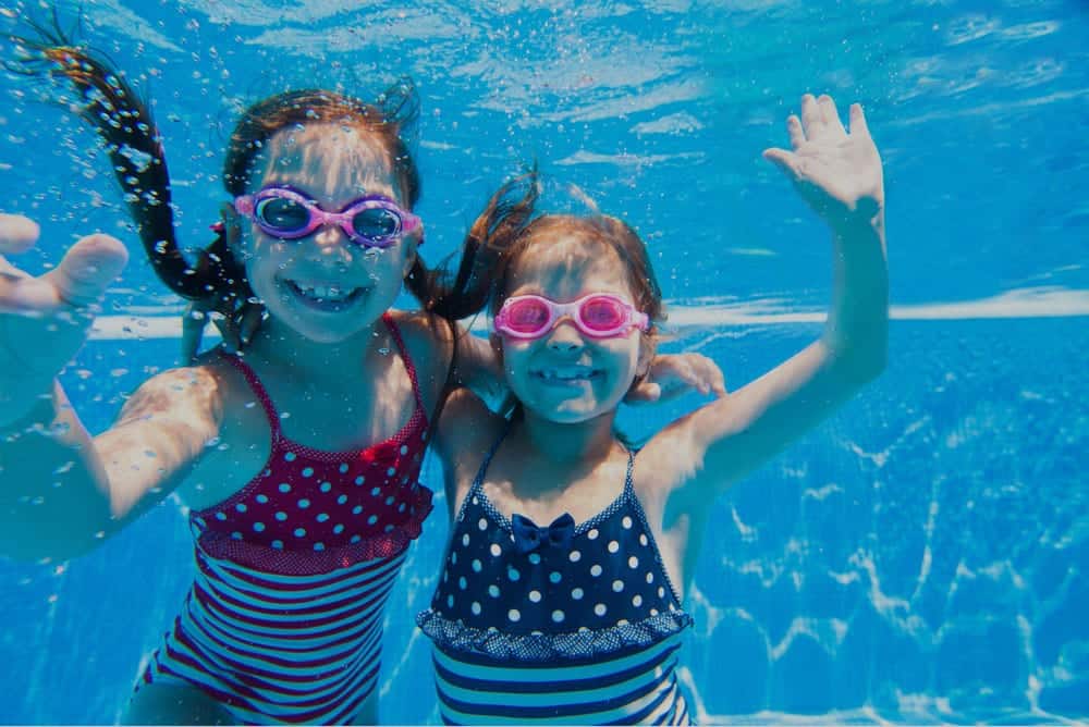 two girls swimming in the pool