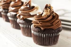 Delicious chocolate cupcakes in a row.